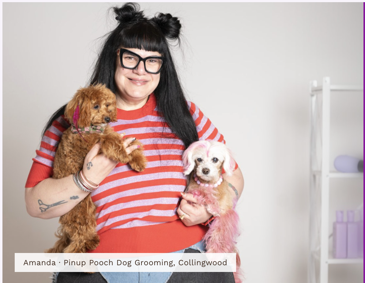 Amanda from Pinup Pooch Dog Grooming Collingwood holding two dogs